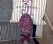 New bespoke oversized autumn Pinecone on distressed wood base in mulberry