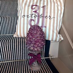 New bespoke oversized autumn Pinecone on distressed wood base in mulberry