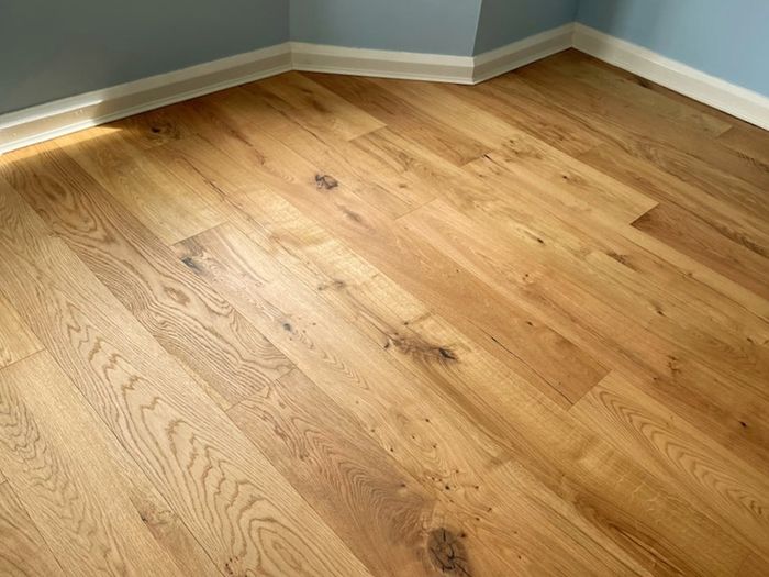 Laminated wood floor fitting