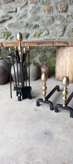 Antique Fire dogs and 4 piece fire set solid brass tops and steel