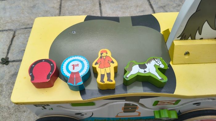 Wooden horse-themed ride-on toy in good used condition