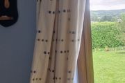 cream heavy curtains with ble &amp; green pattern