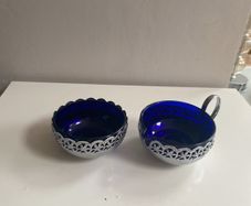 Vintage sugar dish and creamer pierced chrome with blue glass insets