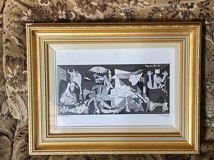This piece is a ceramic art tile featuring Pablo Picasso's iconic masterpiece, Guernica (1937)