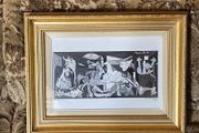 This piece is a ceramic art tile featuring Pablo Picasso's iconic masterpiece, Guernica (1937)