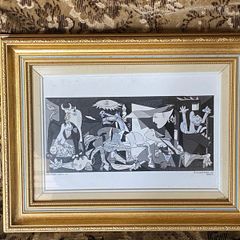 This piece is a ceramic art tile featuring Pablo Picasso's iconic masterpiece, Guernica (1937)