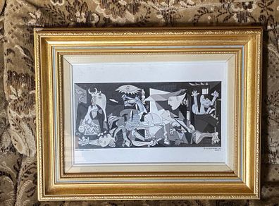 This piece is a ceramic art tile featuring Pablo Picasso's iconic masterpiece, Guernica (1937)