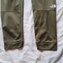 the north face joggers size xl boys green tiny hole at knee Image 4