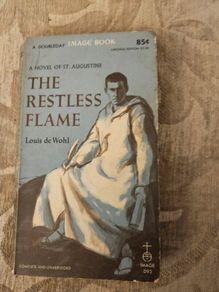 The Restless Flame. A Novel Of St Augustine.  By Louis De Wohl. First Printing 1960 Paperback In Good Condition. See Photos For Same.