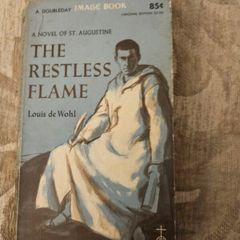 The Restless Flame. A Novel Of St Augustine.  By Louis De Wohl. First Printing 1960 Paperback In Good Condition. See Photos For Same.