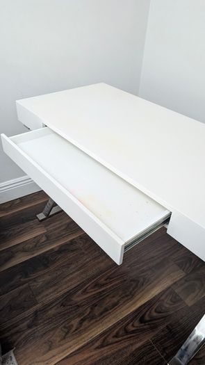 Modern white desk with chrome cross legs