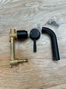 Wall hung black tap unused .Brand new .