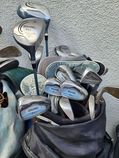 five golf bags and sixty nine clubs . ONE LOT ONLE.
