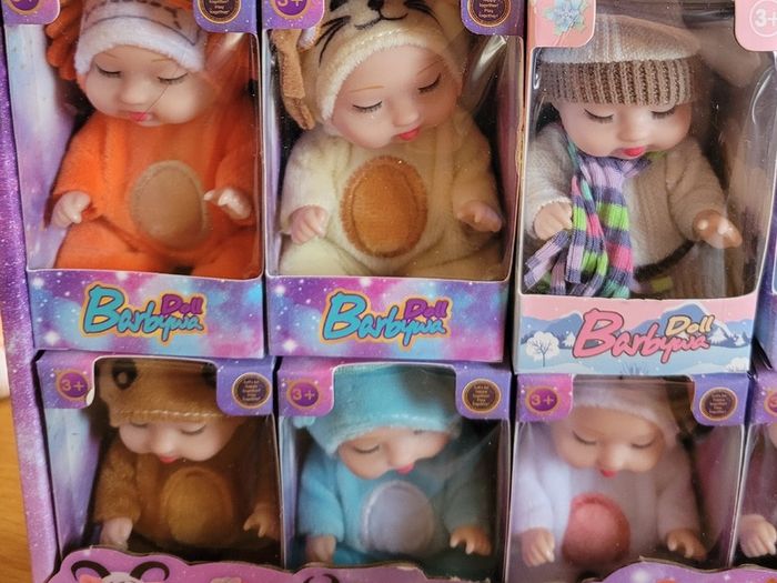 Mini baby dolls in sweet outfits