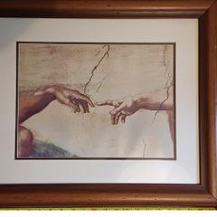 Framed print of Da Vinci's Creation of Adam most famous detail