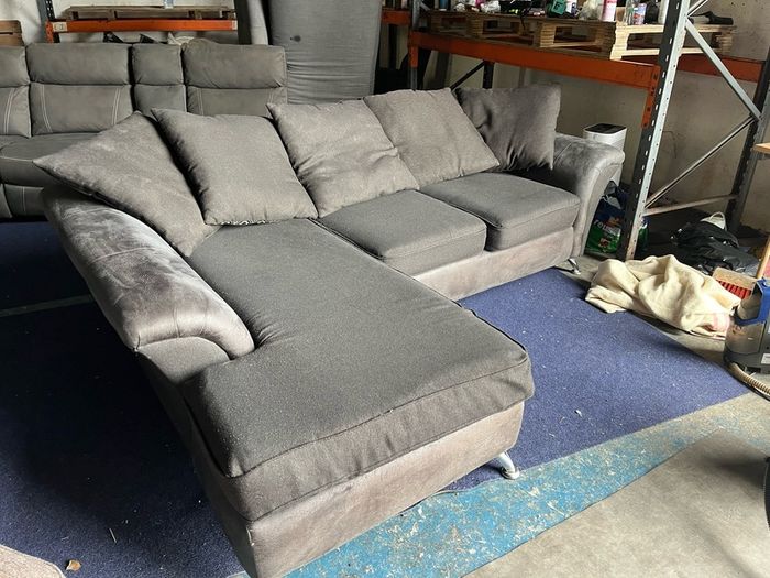 grey/black corner sofa with scatter cushions