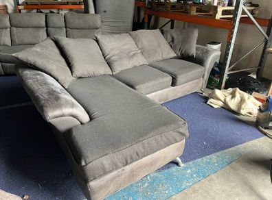 grey/black corner sofa with scatter cushions