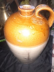 A Antique Stoneware Flagon or 1 Gallon Jug, likely dating from the 19th or early 20th century