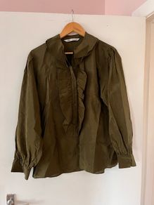 Green frilly blouse