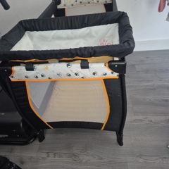 travel cot with baby changer