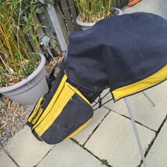 Golg bag with clubs.