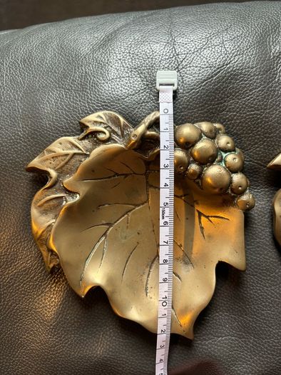 A pair of vintage solid brass grape leaf trinket dishes/ ashtrays