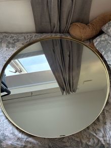 round gold metal mirror