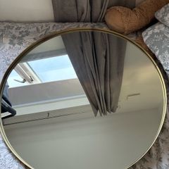 round gold metal mirror