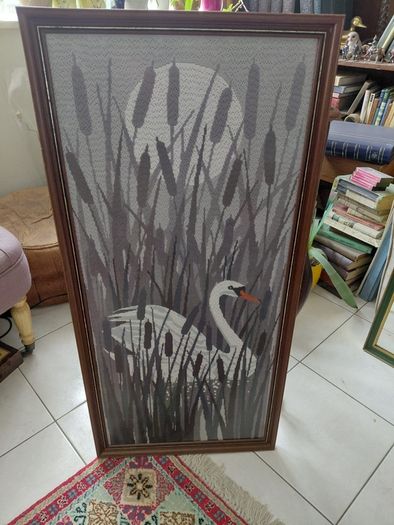 Vintage framed needlepoint tapestry depicting a white swan swimming