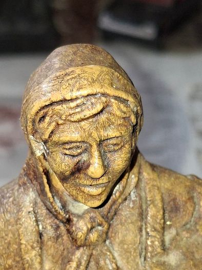 Peasant woman c1950s Wearing a Headscarf and Apron while carrying a bundle of provisions, features detailed facial expressions, textured clothing folds, and a base characteristic of regional decorative collectibles, Postage Available or Collection,