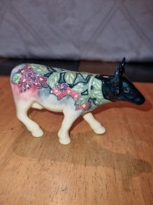 Porcelain colorful cow figurine