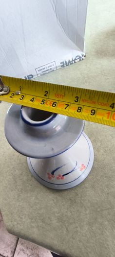 3 different itmes- 1- pottery modern design handmade candle holder 18.00 euro. 2-  red enamel candlestick holder and drip tray featuring a Considered by Helen James 12.00 euro. 3-  PAPERWEIGHT 15.00 euro
