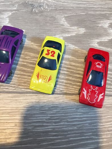 Four plastic Toy Cars