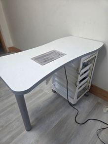 Nail manicure table with installed dust extractor