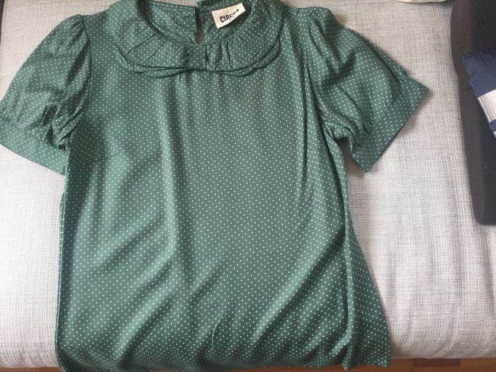Green short sleeved top with small white dots, never worn
