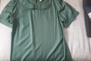 Green short sleeved top with small white dots, never worn
