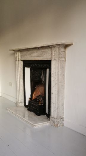 Regency Carrera Marble Bullseye Fireplace