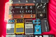 guitar and bass pedals, footdrums, bass amp and wearable metronome