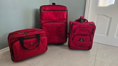 3 matching suitcases plus 1