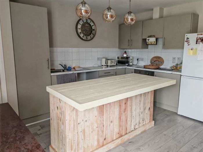 Rustic kitchen island with overhang