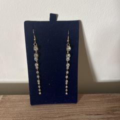 Long gold tone sparkling earrings