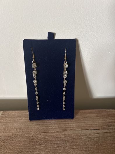 Long gold tone sparkling earrings