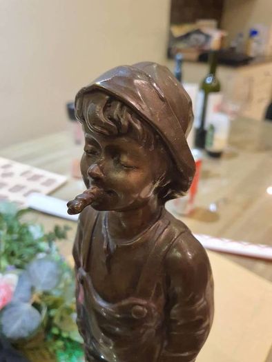 Fisher boy, bronze statue