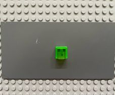 lego Minecraft Minifigure, Head, Modified Cube with Pixelated Dark Green Eyes and Mouth Pattern (Minecraft Slime) minifigure
