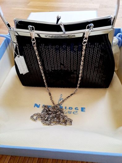 Newbridge black evening bag in box.