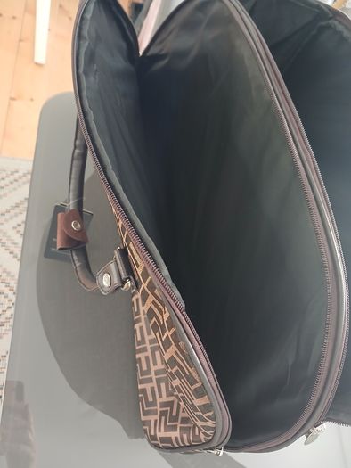 Brown carrier bag on wheels
