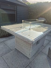 Beautiful, barely used, rattan fire pit table.