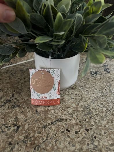 artificial plant in white pot home decor