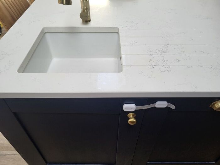 Kitchen units, island and quartz worktops.