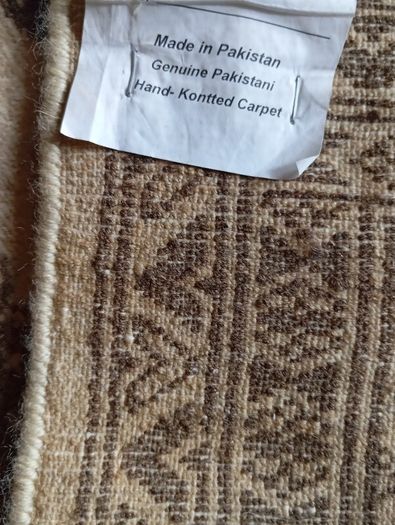 Vintage handwoven fringed rug.